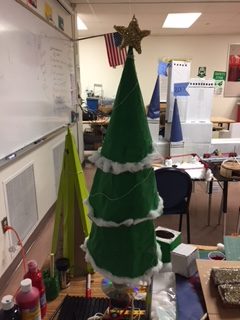 An image of the Christmas Tree mechanism of first period POE and in the backdrop Period 2 Cinderellas castle both for Winter Wonderland.