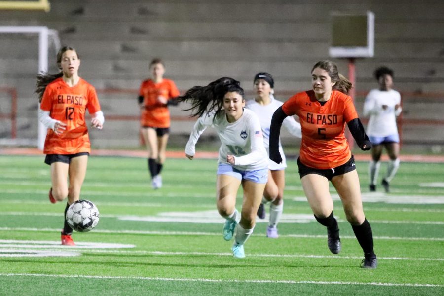 Playing the forward position, senior Valerie Basurto hustles to the ball in the second half against the defender from El Paso High. The game took place at El Paso High with temperatures in the low fifties.  