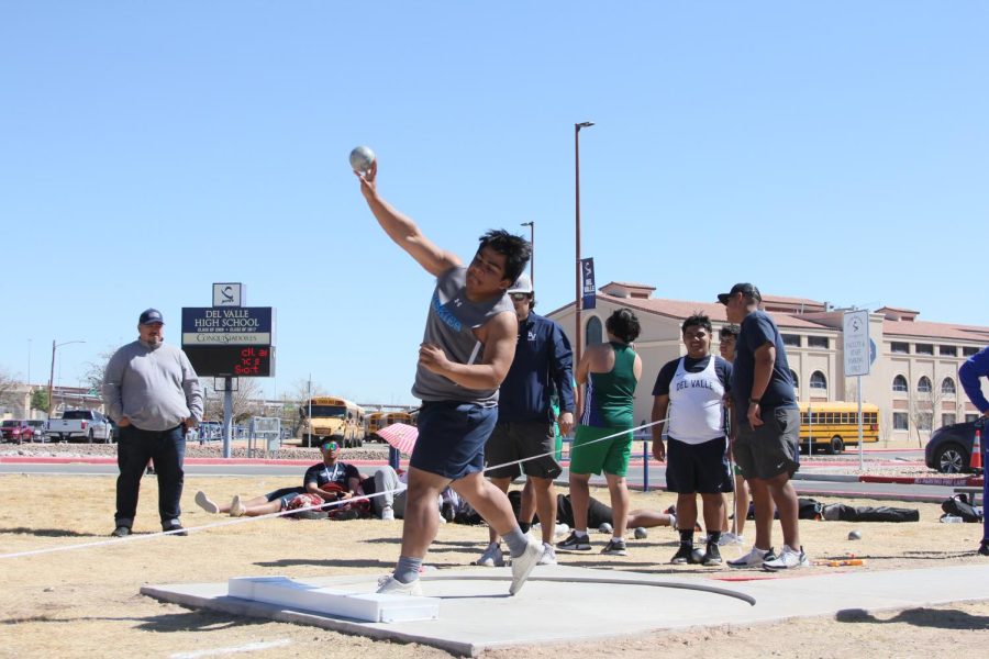 _____ earning the throw that gets him first in Boys Varsity Shot Put.
