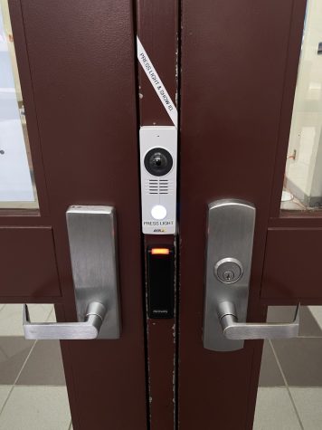The system that you have to use to enter the building with a camera ,button, and voice speaker.