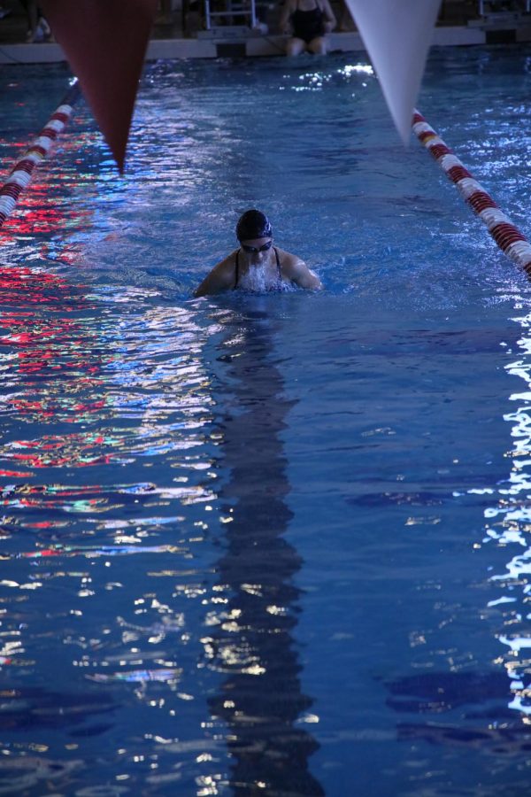 junior Camila Aguirre midway through her 50 meter breaststroke in the 200 medley relay.
