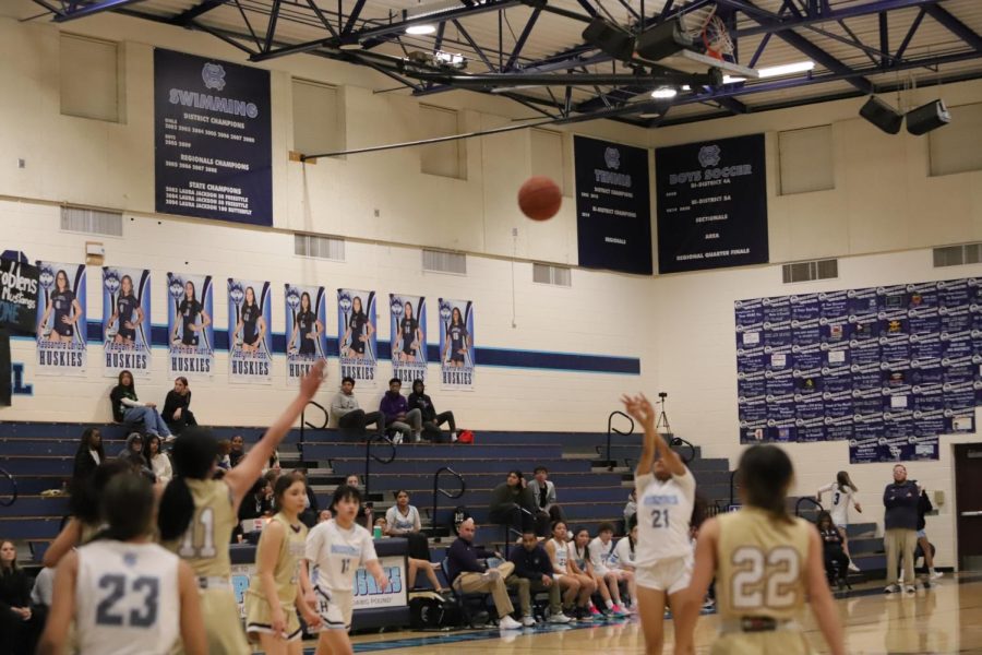 sophomore Isa Armijo shooting a 3 and making it.