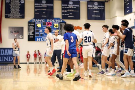Senior Eli Rodriguez supports teammate Brandon Hymes by saying Lets Go!, after he scores another two pointer. All players on the bench rose to their feet to cheer on Hymes.              