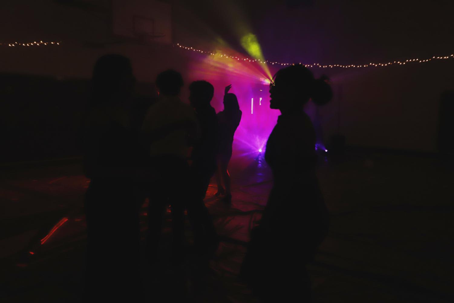 Chapin students dance in techno colored lights.
