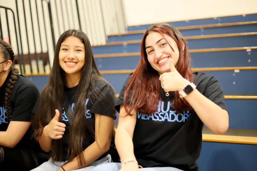 Senior Michelle Velasco and Carymar Lopez-Cruz are waiting for the eighth grade orientation to complete since they will be doing tours as a husky ambassador.