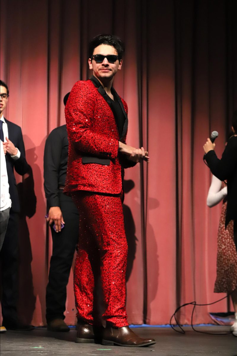 Doing a double take, senior Gabriel Ortega practices his entrance before the show starts. I wanted something that would wow the crowd, Gabriel said. Also something I knew I could do without getting embarrassed.   