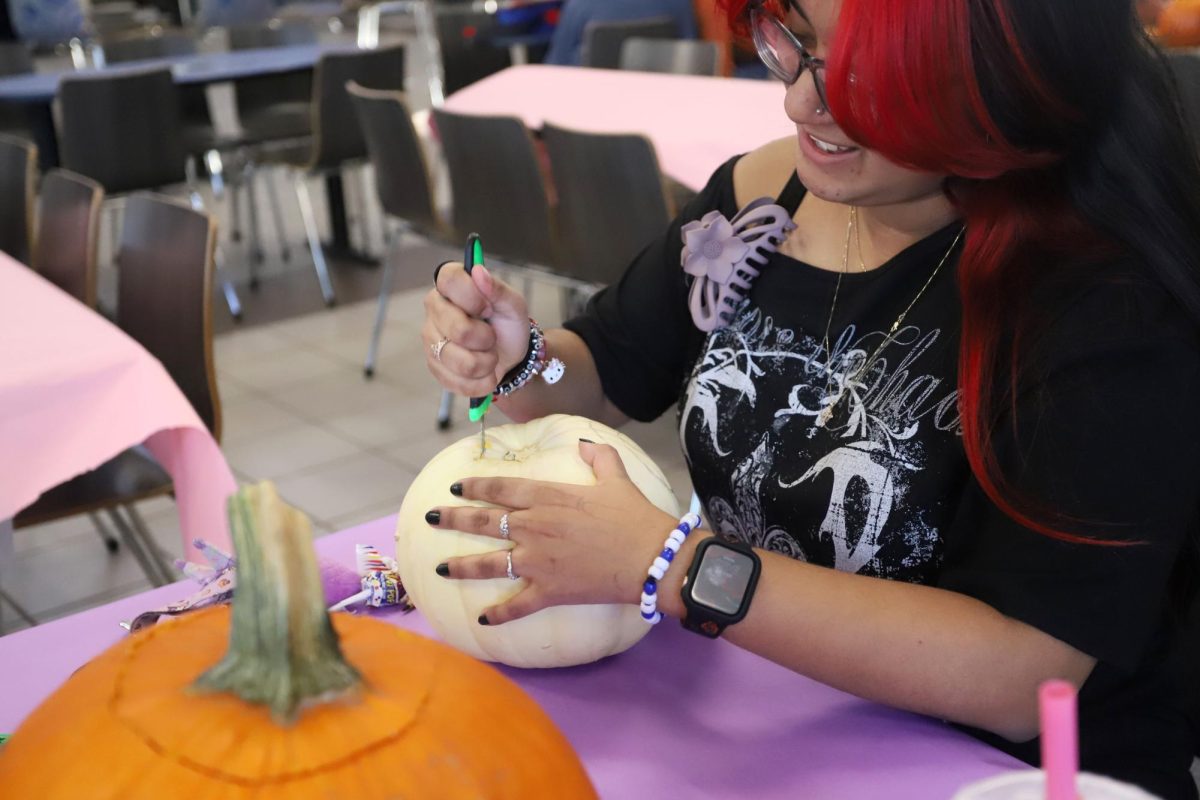 Having finalized her design, Senior Myla Tarin begins the carving process. 