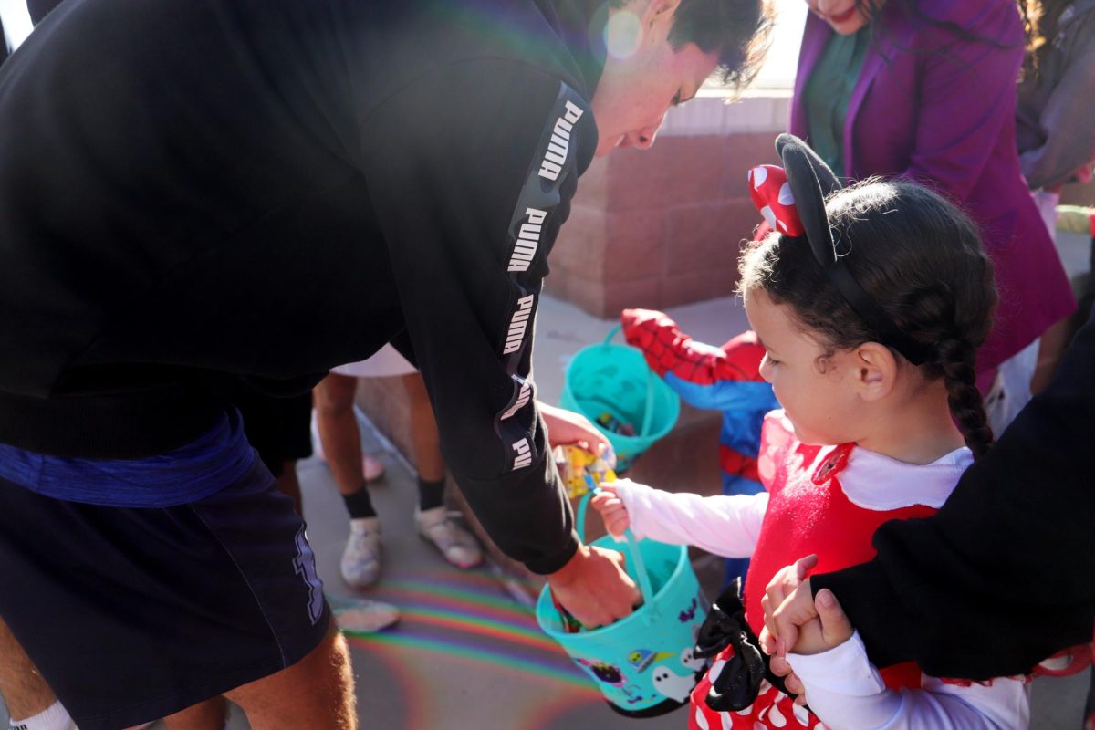  The kids got their baskets filled with with all the candy the soccer players gave them.