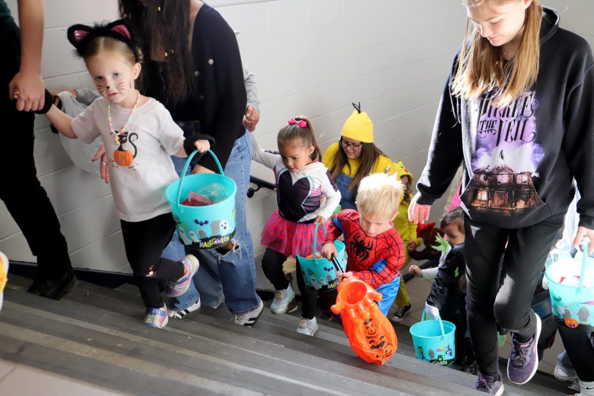 Running up the stairs the CDL kids were all done getting their candy downstair and were ready to go upstairs."I was excited to dress up with the kids", said senior Sophie D La Cruz.