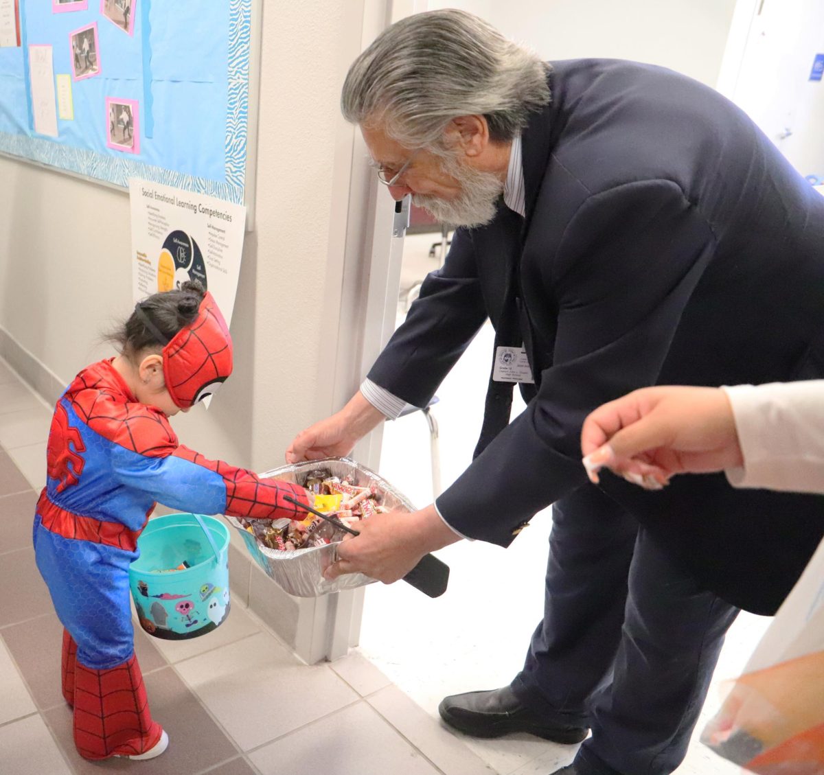 The energy of the event was infectious as assistant principal Mr. Jaques gets amused by the customes." Wow your costume is so cool I really like spiderman".