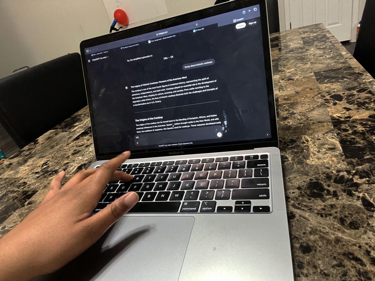 Artificial intelligence in students hands. A student uses chat gpt to tackle their work. They are asking for ideas for an essay, but is also copying word for word.