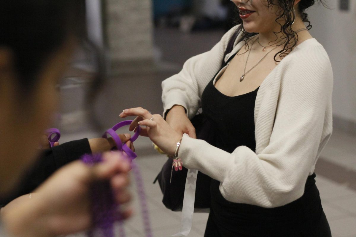 Crystal Martinez helps put the student event together. "It was really fun to give back to the military kids, and I really enjoyed this," Crystal said. She gave out lots of gear, putting smiles on student faces.