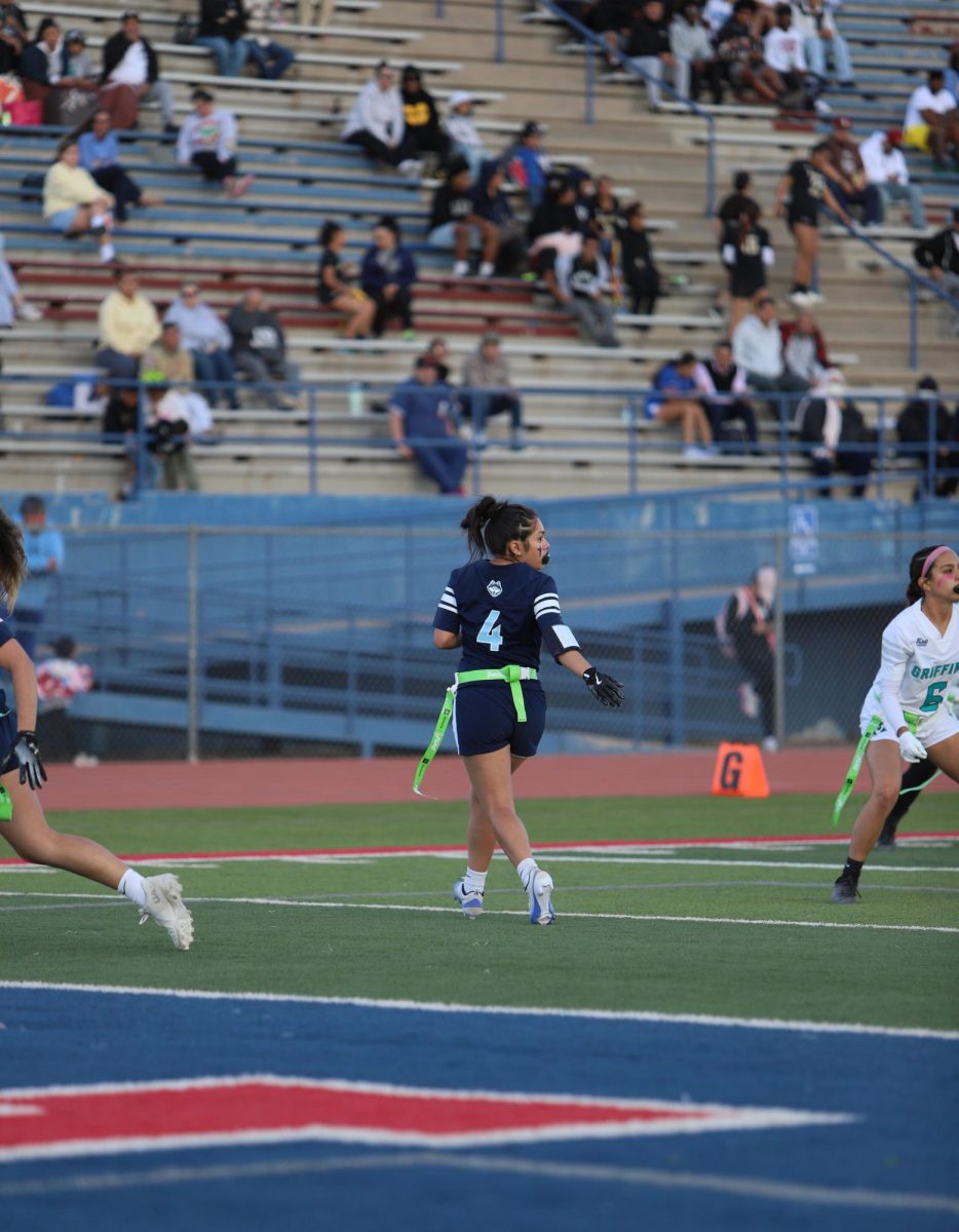 Junior Allison glancing over her shoulder, looking to see if the ball is going in her path. The ball didn't go her way but she was ready. " I feel I always need to be ready just in case the ball is going to me," Allison said. 