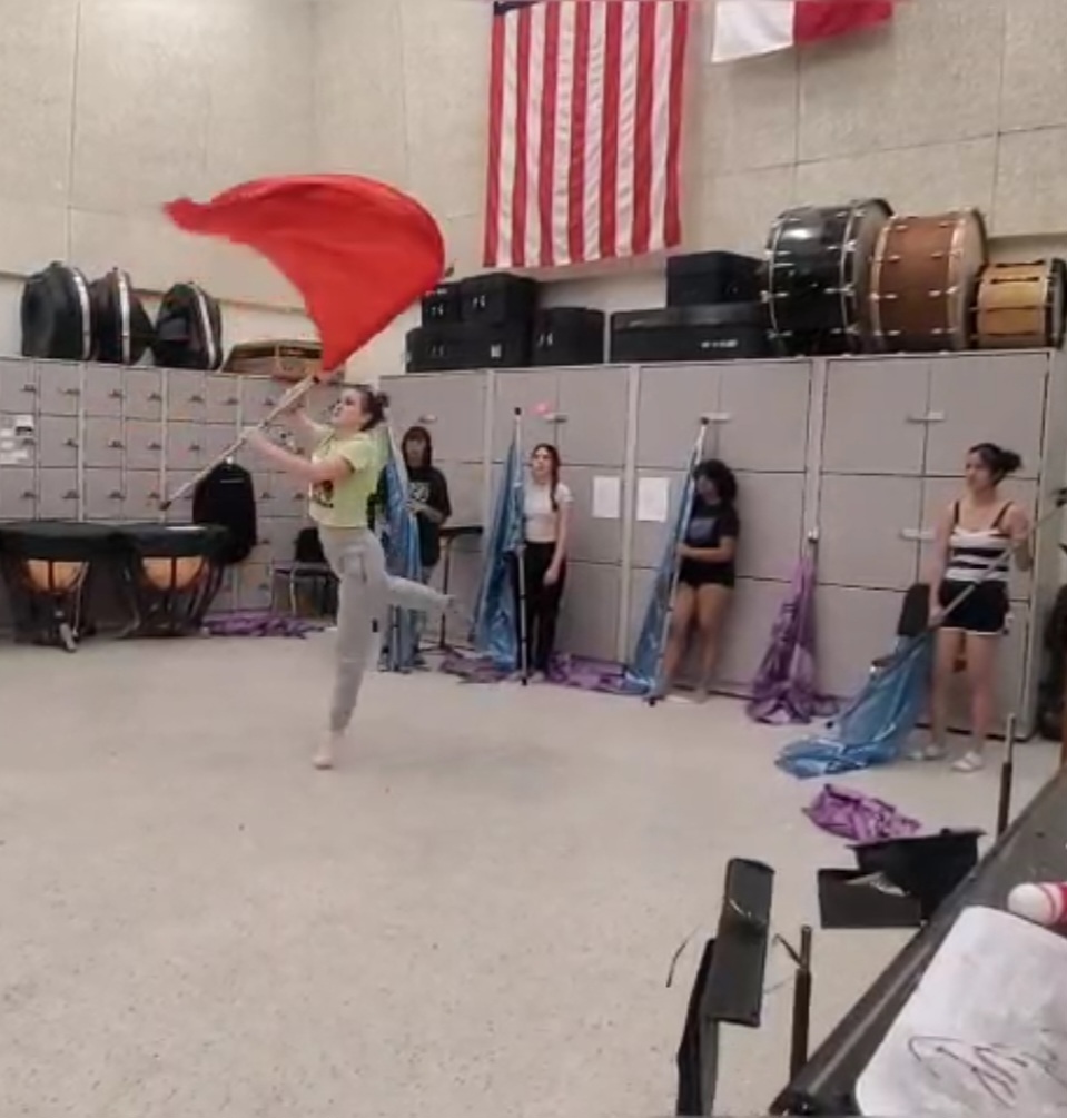 New choreographer Kendall Uribe teaches the Blue Ribbon color guard choreography for the spring concert performance. This will be the first performance showcasing Kendall's skills as a choreographer. "I love that the ending is the climax," sophomore Kayla Creel said. "I think the show is perfect." 