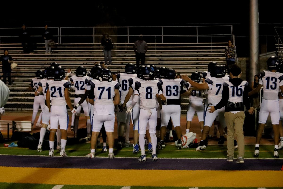 After a big win against Burges highschool, JV Celebrates by doing Jumping jacks to the parents.