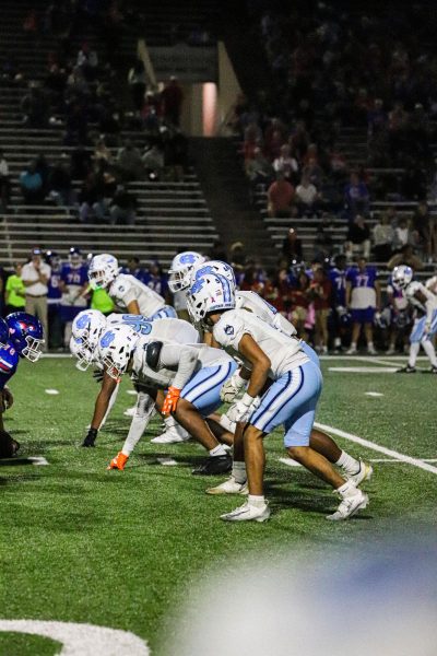Locked in at the line, Chapin’s defense readies for the next snap against Abilene Cooper showing the blitz.