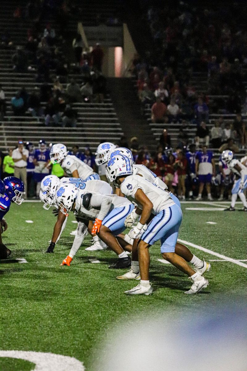 Locked in at the line, Chapin’s defense readies for the next snap against Abilene Cooper showing the blitz.