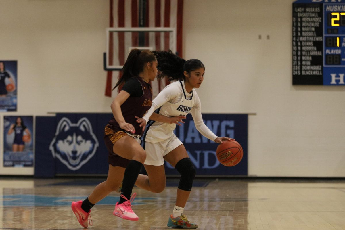 Driving strong through traffic, determined to finish the play. 
