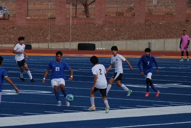 Canutillo pushes forward while Chapin closes in for the stop.