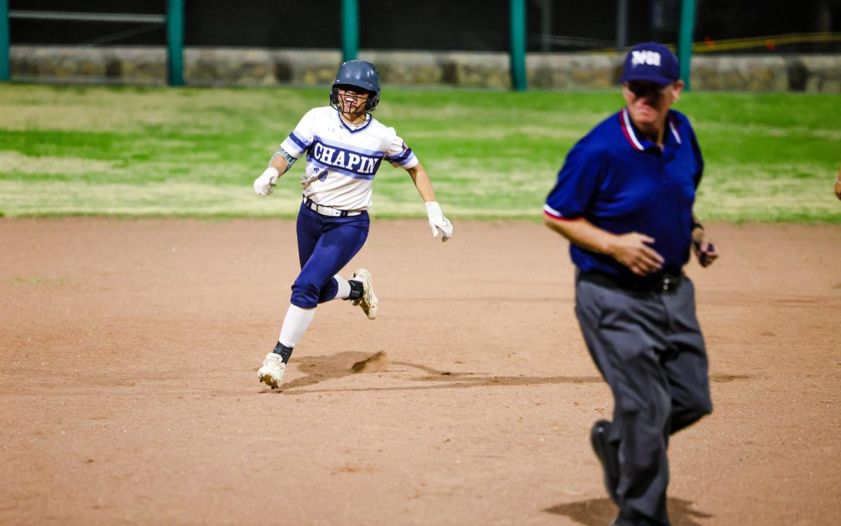 DRIVING FORCE. Looking for a gap in the outfield, sophomore catcher Yaretzi Acosta (#17) begins her stride. The win marked Chapin’s sixth consecutive victory, improving their mid-season record to 16-5.