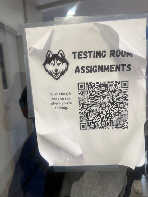 Students scan a QR code to find their TELPAS testing room assignments.