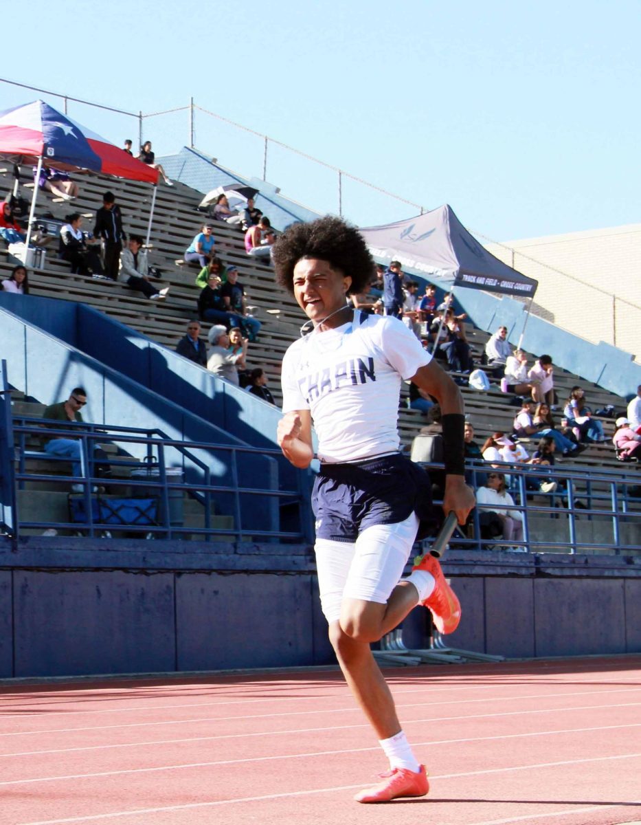 Elijah Hairston runs the 200m relay, allowing his team to place 1st with a time of 1:33.07.