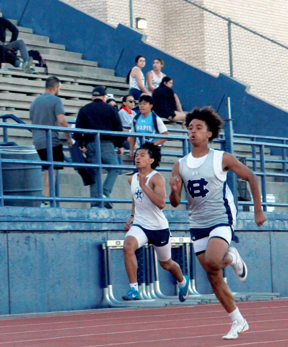 Jeshua Ramos places 1st in the freshman 200m finals with a time of 23.71.