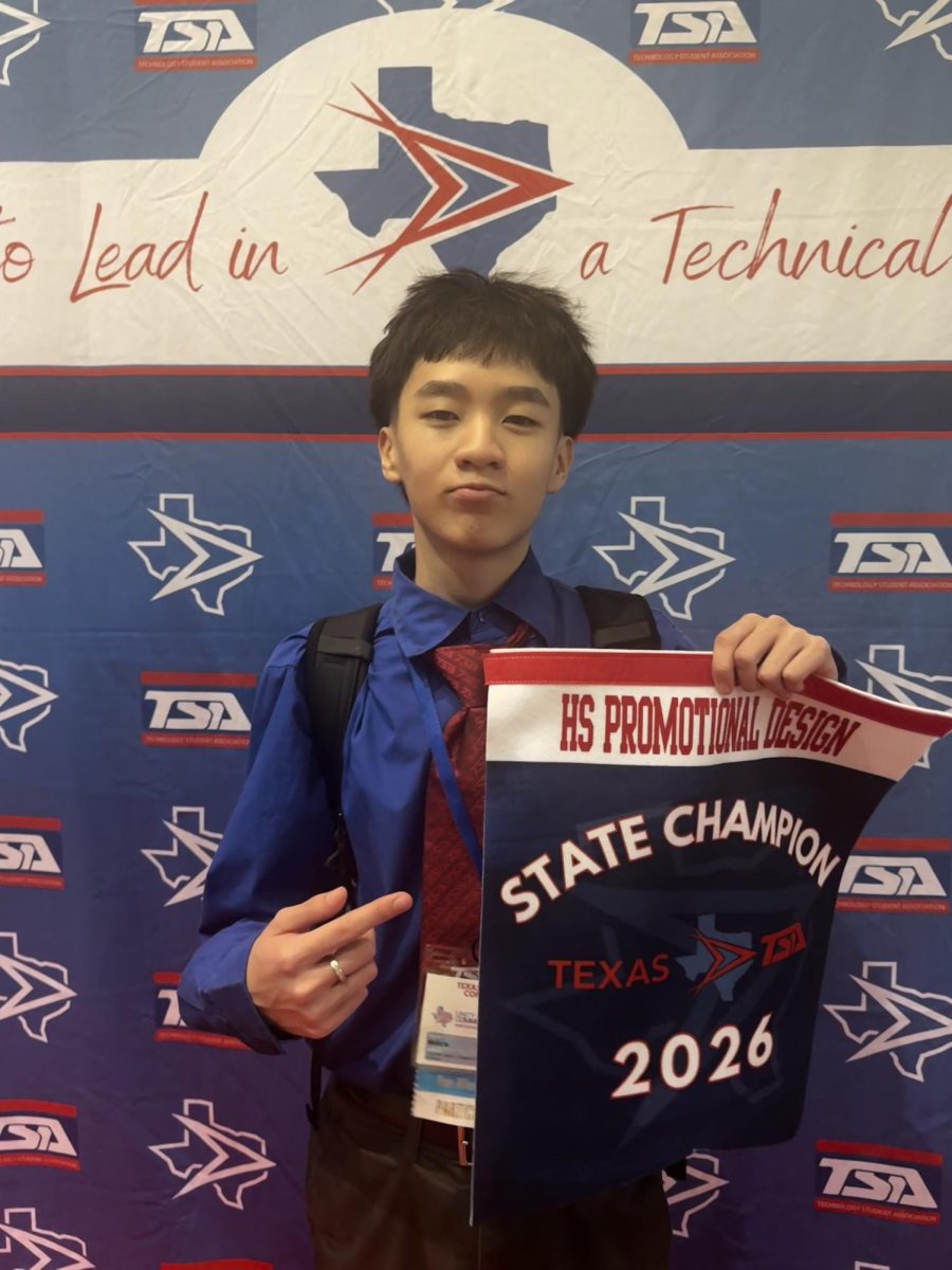 Sophomore Wesley Vo displays his state champion banner for Promotional Design following his first-place victory.